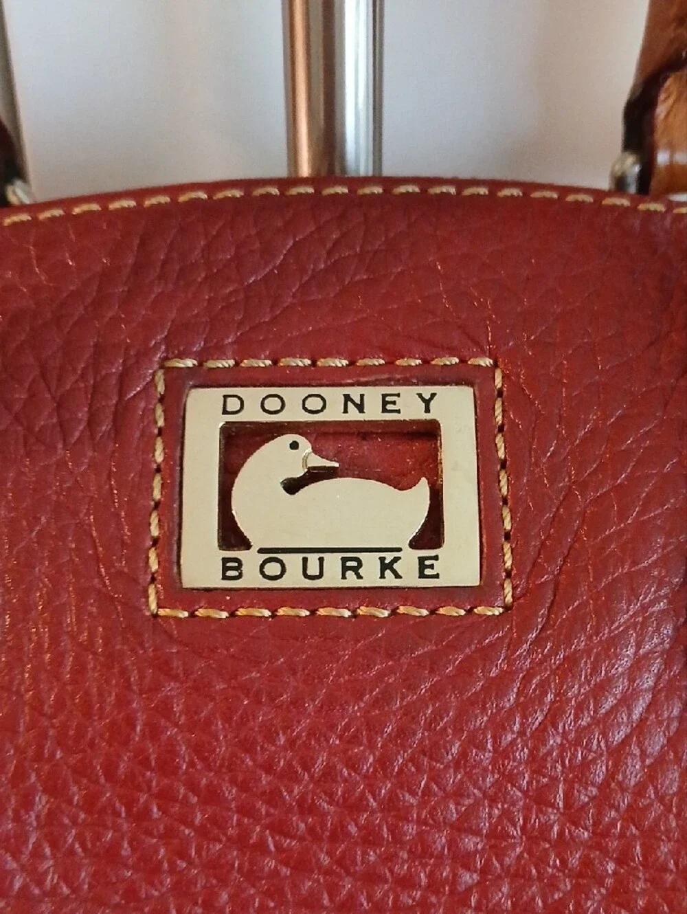 Dooney & Bourke Burgundy Pebbled Leather Satchel with Tan Accents